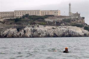 Shackled but making waves- Jay Platt swimming from Alcatraz Island to San Francisco with his hands and feet tied. 